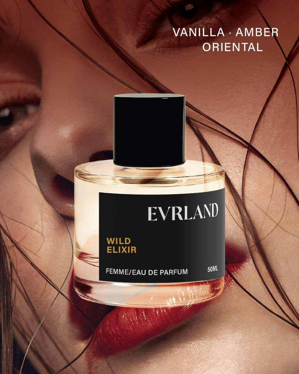 Perfume bottle labeled 'Evrland Wild Elixir' with a close-up of a woman's face.
